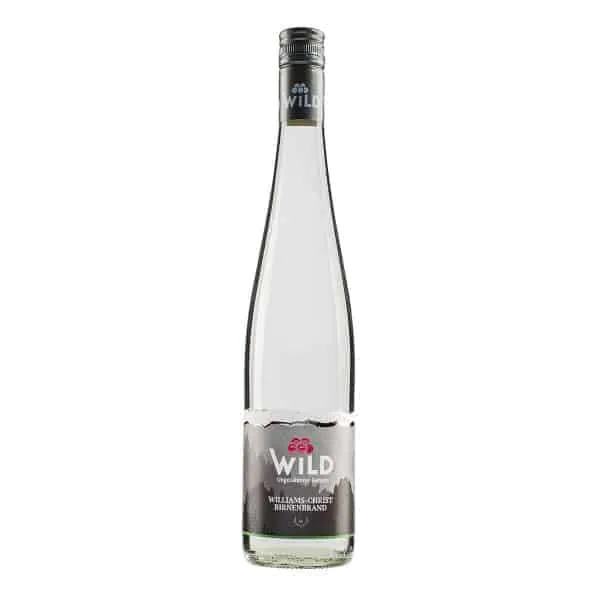 Klarglasflasche von Wild Williams-Christ Birnenbrand mit silbernem Verschluss und einem Etikett mit Bergmotiv und roten Kirschen.