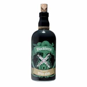 Eine Flasche Bratapfellikör aus dunklem Glas mit Korkverschluss und einem illustrierten grün-goldenen Etikett.