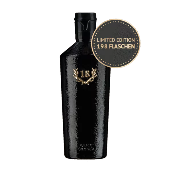Eine schwarze Flasche 1997 Birnenbrand Palmisch im Ex-Laphroaig-Fass mit 18 und Lorbeer, die in einer limitierten Auflage von nur 198 Flaschen auf den Markt kommt.